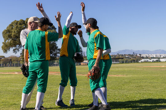 Vertical video: Five baseball players celebrating after run by mound, animated stats over gloves