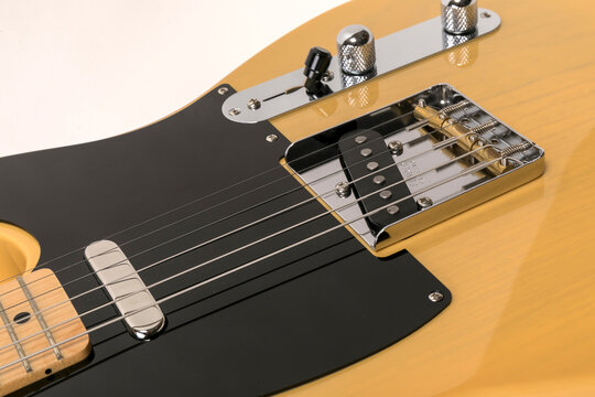Close-up of Fender telecaster,classic electric guitar, picup,bridge,microphone and steel strings