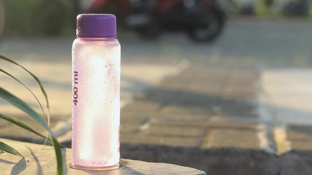 A 400 millimeter bottle of cold water in the garden	