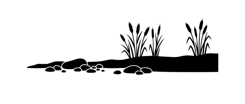 Black silhouette of reeds cattails and stones on a riverbank