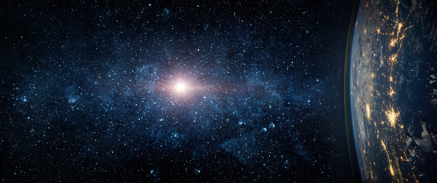 View from space of sunrise over planet Earth with glowing atmosphere, clouds and sunlight on the horizon. Dramatic cosmic landscape with deep space background. Elements of this image furnished by NASA