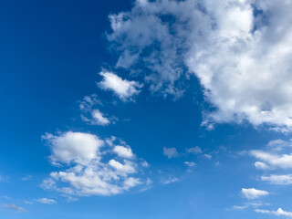 Obraz premium Blue Sky with Fluffy White Clouds