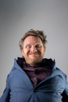 Exaggerated Comedic Expression in Blue Suit Jacket