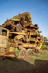 Fototapeta premium Pile of trucks and military vehicles at the tank graveyard in Asmara, Eritrea