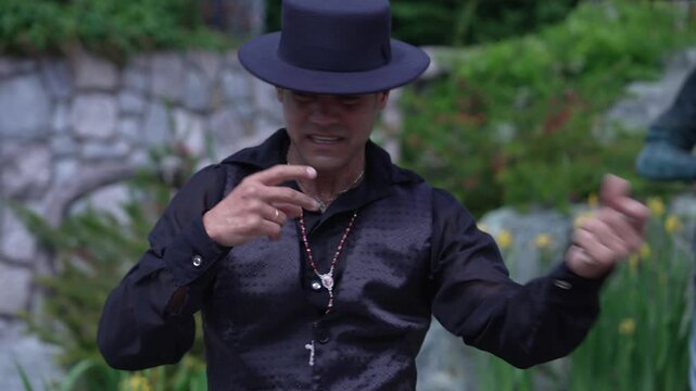Authentic Spanish man dancing flamenco. Dance technique, floreo pitos braceo palmas