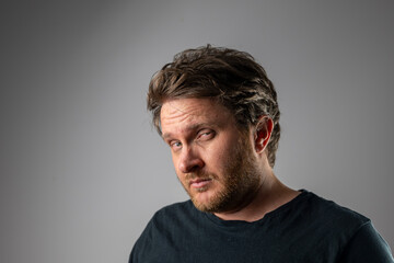 Obraz premium Serious Portrait of Adult Man Looking at Camera