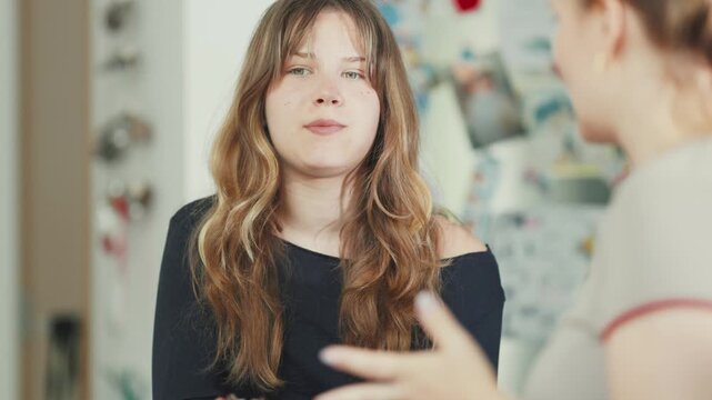 Mother and teenage daughter having a candid conversation