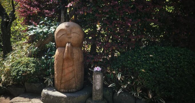 Jizo Stone Statue with Praying Hands in Japanese Garden - Medium, Steady Cam Shot