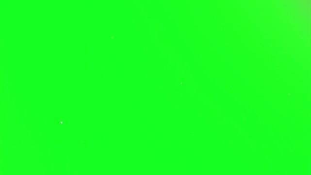 Glitter dust rain falling down smoothly on a green screen layout adding a luxury premium feel to wedding invitations, celebrity awards background, fashion shows, and elite video events professio.