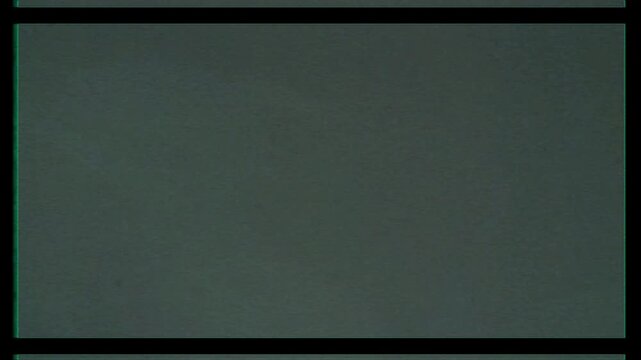 Abstract dark green background with subtle grainy texture and film border.