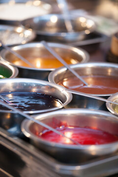 Colorful sauces and condiments at a street food market, Xi'an, Shaanxi, China