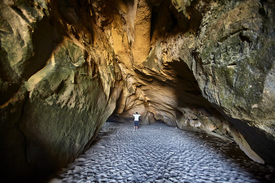 Time carved in stone &mdash; sinuous, wind-sculpted sandstone walls form a dramatic natural corridor along the raw, untamed coastline of Lobitos, Piura, Peru, where millennia of Pacific winds, salt-laden ai