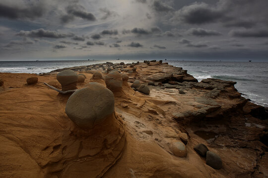 Time carved in stone &mdash; sinuous, wind-sculpted sandstone walls form a dramatic natural corridor along the raw, untamed coastline of Lobitos, Piura, Peru, where millennia of Pacific winds, salt-laden ai