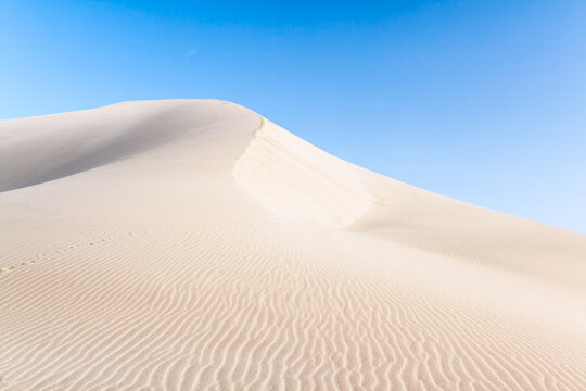 Mingsha singing sand dunes at golden hour, Gansu, China