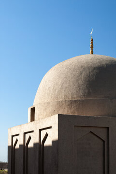Dome and crescent of the Emin mosque against blue sky, Turpan, Xinjiang, China