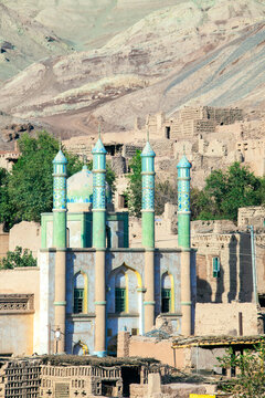 Mosque facade and minaret in the streets of Toyuq, Turpan, Xinjiang, China