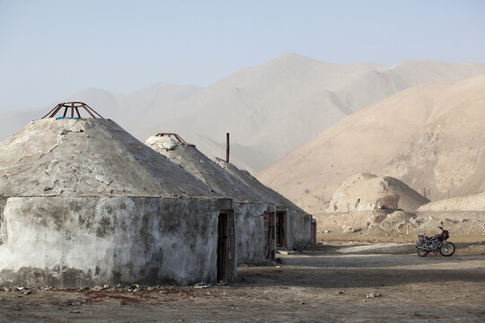 Kyrgyz yurts with Karakul lake in the background, Karakul, Xinjiang, China