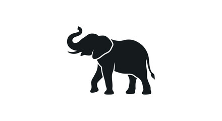 Obraz premium Silhouette of an African elephant walking with its trunk raised.