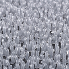 Fototapeta premium Abstract texture of many small plastic spikes, close up