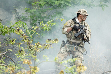 Naklejka premium US Marine, Military Special forces soldier under heavy enemy fire intense battlefield engagement