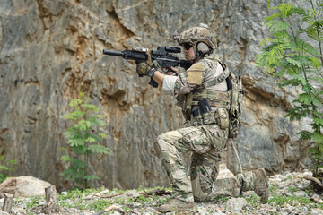 Naklejka premium US Special forces soldiers engaged in combat operation, tactical military team in action