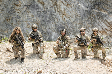 Naklejka premium Military special forces soldier team in combat operation, tactical military portrait in action