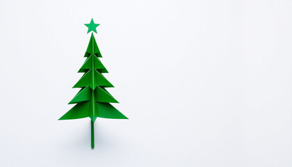 Fototapeta premium Minimalist Green Origami Christmas Tree Paper Craft on Isolated Background
