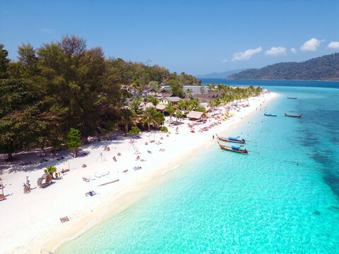 Aerial Drone View of Koh Lipe Island Beach with Turquoise Water and Longtail Boats, Thailand