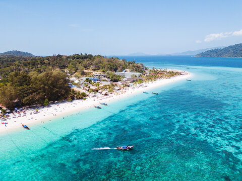 Aerial Drone View of Koh Lipe Island Beach with Turquoise Water and Longtail Boats, Thailand