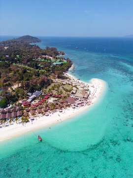 Aerial Drone View of Koh Lipe Island Beach with Turquoise Water and Longtail Boats, Thailand
