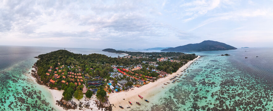 Aerial Drone View of Koh Lipe Island Beach with Turquoise Water and Longtail Boats, Thailand
