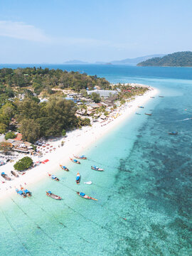 Aerial Drone View of Long tail Boats in Koh Lipe Island, amazing beach with Turquoise Water, Thailand