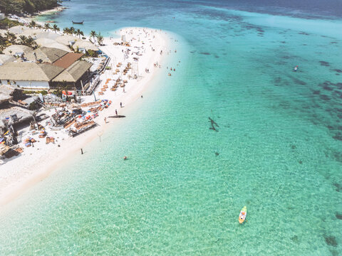 Aerial Drone View of Koh Lipe Island Beach with Turquoise Water and Longtail Boats, Thailand