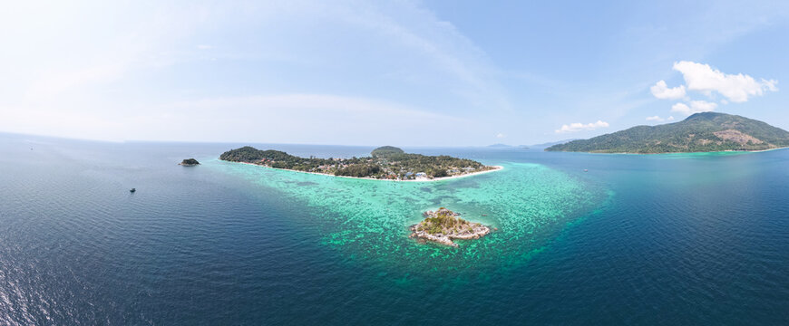 Aerial Drone View of Koh Lipe Island Beach with Turquoise Water and Longtail Boats, Thailand
