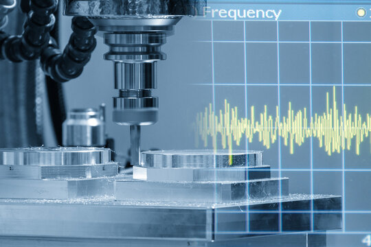 Abstract technology scene of a CNC milling machine cutting aluminum parts layered with a frequency graph background in light blue.