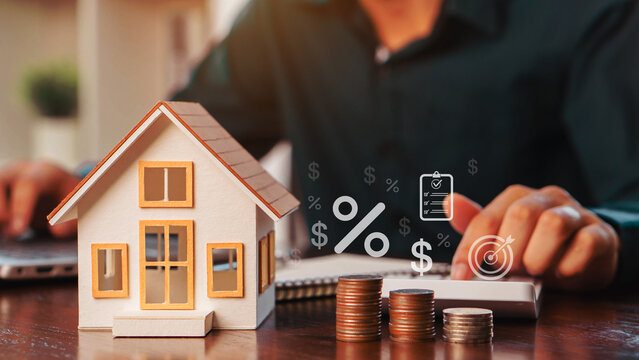House model, stacked coins, calculator, and interest rate symbols illustrate mortgage planning, home loans, property investment, financial management, refinancing, and real estate wealth growth.