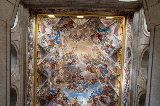 San Lorenzo de El Escorial, Spain. Vault fresco La Gloria de la Monarquia Espanola (1692-1694) by Luca Giordano on the main staircase, depicting the Habsburg dynasty before the Holy Trinity