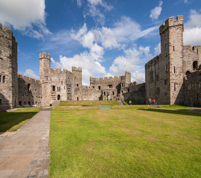 Impressive panorama of Carnarvon castle with sunny blue sky. Caernarfon, Wales, UK