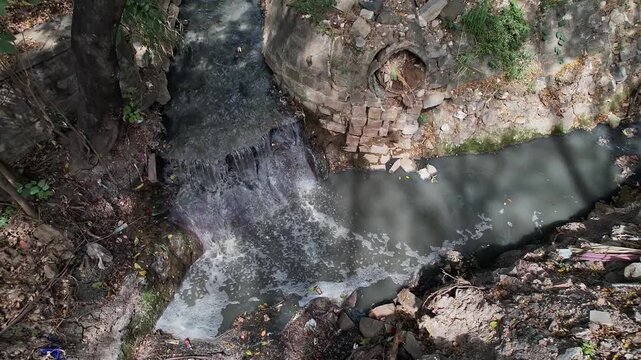 View shows a Overflowing drain Surpassing Debris Filled Area with Stagnant Water