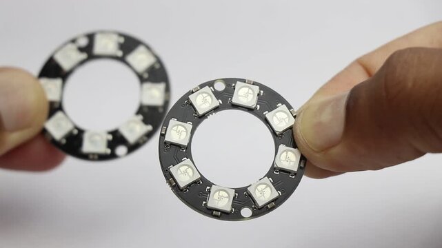 Pair of ARGB LED ring light modules with unsoldered pins. Electronics component for DIY projects