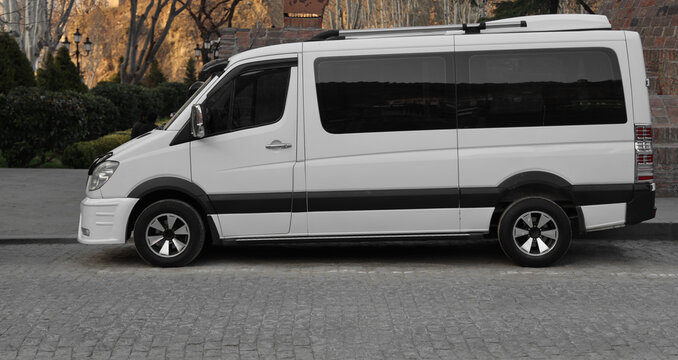 Tbilisi, Georgia - March 13, 2026: Side front view of white car micro mini bus Mercedes-Benz W906 Sprinter Mercedes Benz is a light commercial vehicle built by Daimler AG of Stuttgart, Germany.