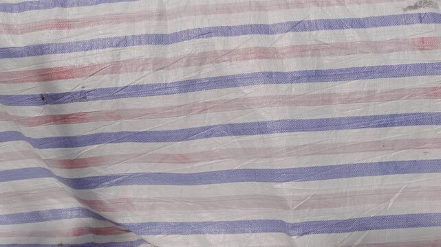 Striped Woven Plastic Tarpaulin Texture Background with Surface Details