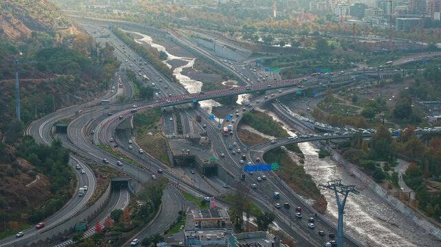 Aerial Drone Dolly In Over Costanera Highway and Mapocho River Santiago Chile Traffic High Frame Rate