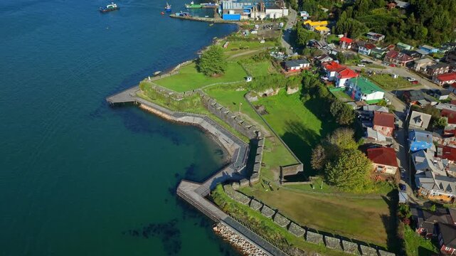 Aerial birdseye rising over San Sebastian de la Cruz Castle, Corral, Chile