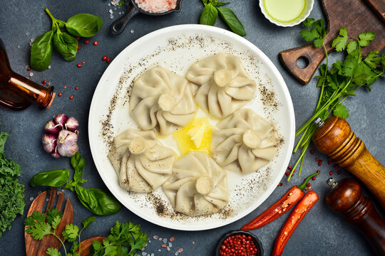 Boiled khinkali with lamb or beef or cheese. Traditional Georgian dish khinkali. Hinkali on a plate.