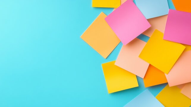 Vibrant blank sticky notes (pink, yellow, orange, blue hues) scattered on an aqua background, a colorful flat lay with negative space for ideas and reminders. notes, planning