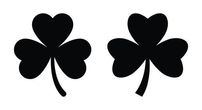 Two clover leaves with stems depicted as a black silhouette cloverleaf