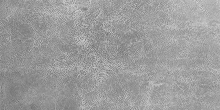 A close-up texture of aged, weathered leather shows a distressed, grey surface with fine lines and subtle grain.