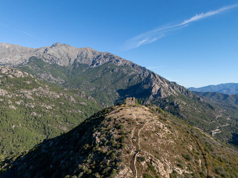 Vivario castle ruins standing on a mountain peak in Corsica