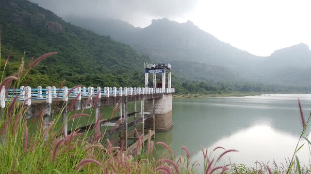Scenic Canal Sluice Reservoir Amid Mountains and Greenery